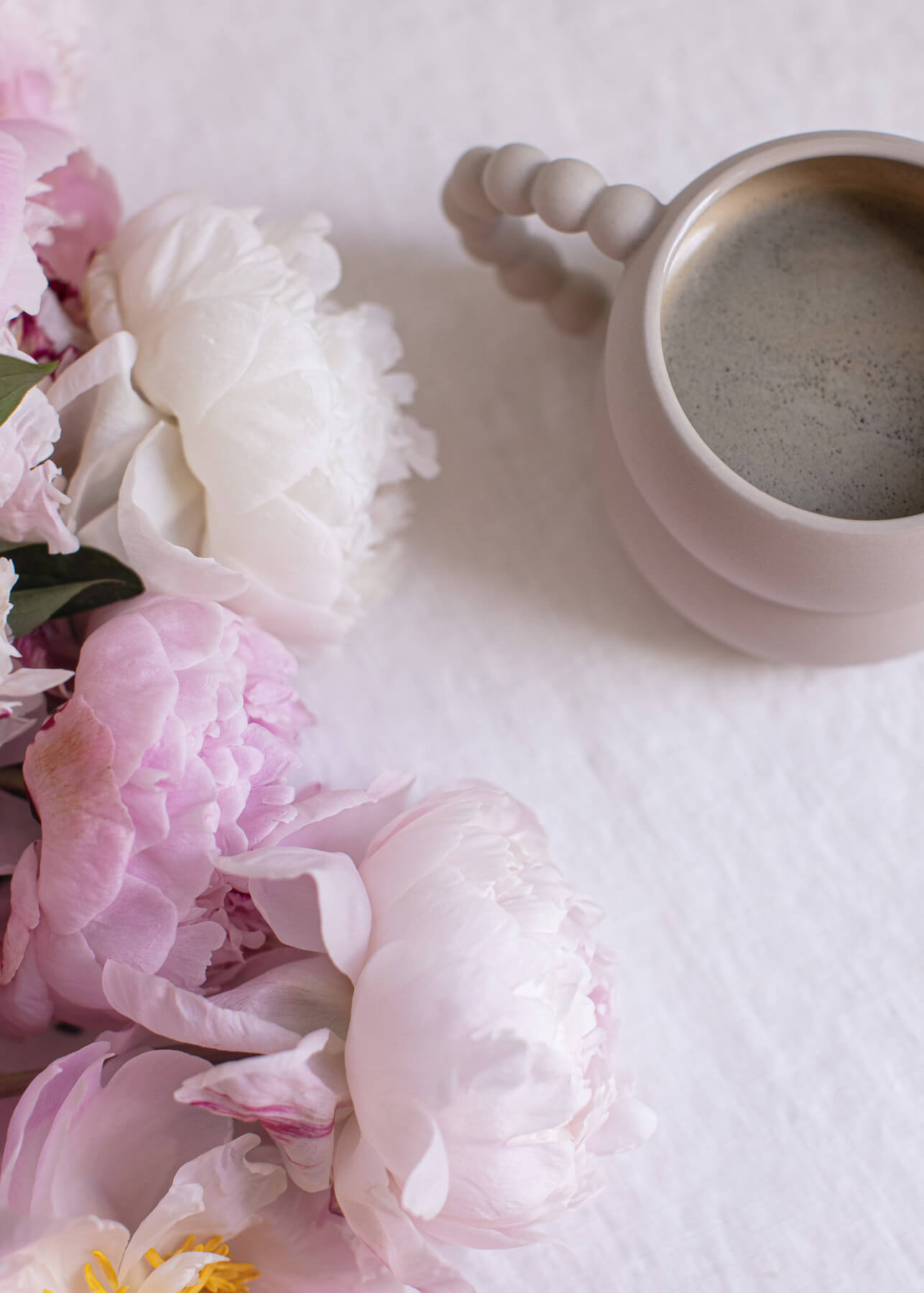 weekend reading with flowers and coffee