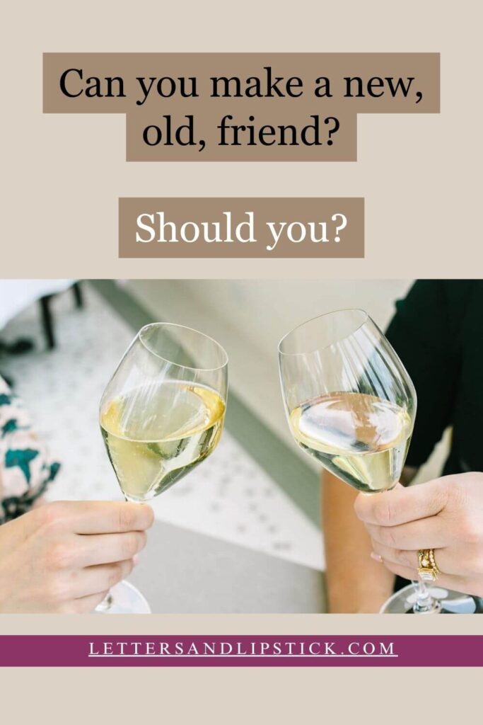 two white wine glasses and friends