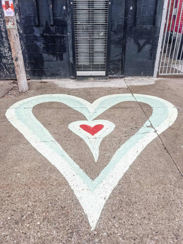 heart painted on a sidewalk in downtown toronto